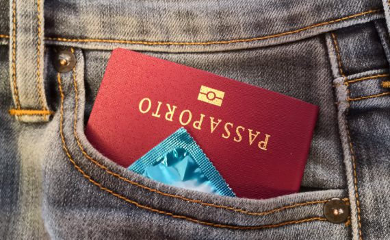 A passport and a condom in the pocket of some jeans