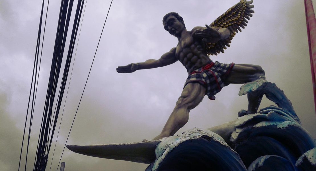 Super Kitsch surfing god statue