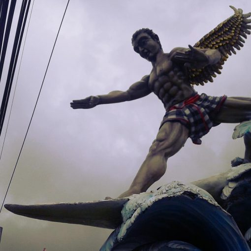 Super Kitsch surfing god statue