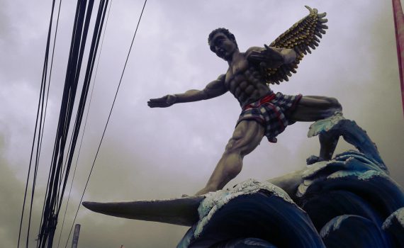 Super Kitsch surfing god statue